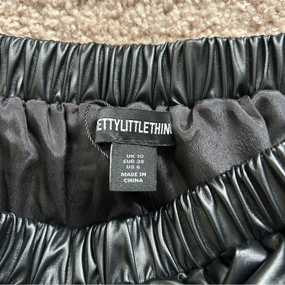 PrettyLittleThing Black Faux Leather Puff Ball Mini Skirt Size 6